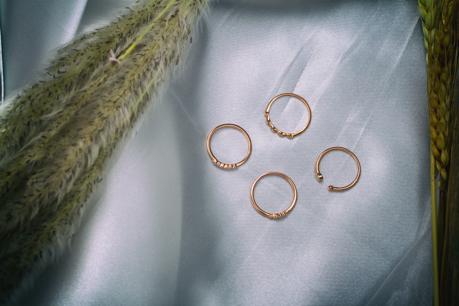 gold rings on white textile